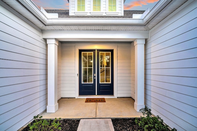 exterior entry at dusk with french doors