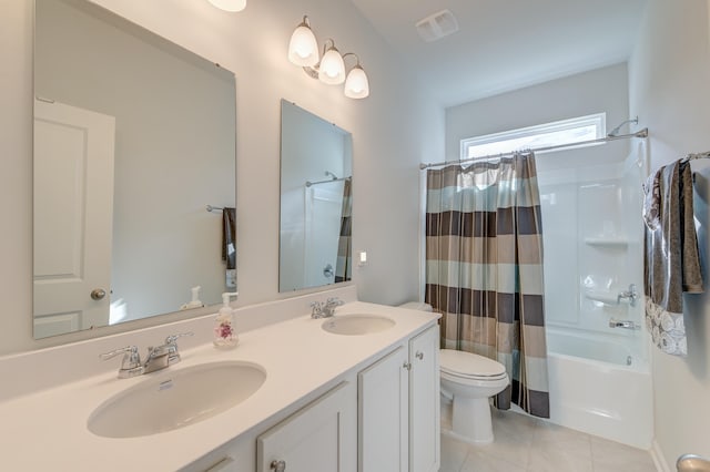 full bathroom featuring tile patterned flooring, vanity, shower / bath combo, and toilet