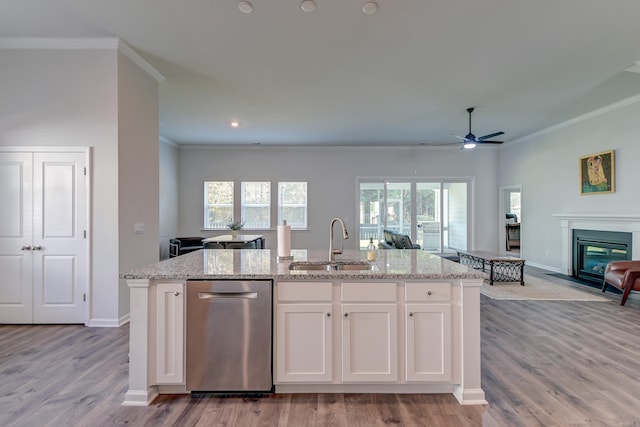 kitchen featuring white cabinets, dishwasher, plenty of natural light, and sink