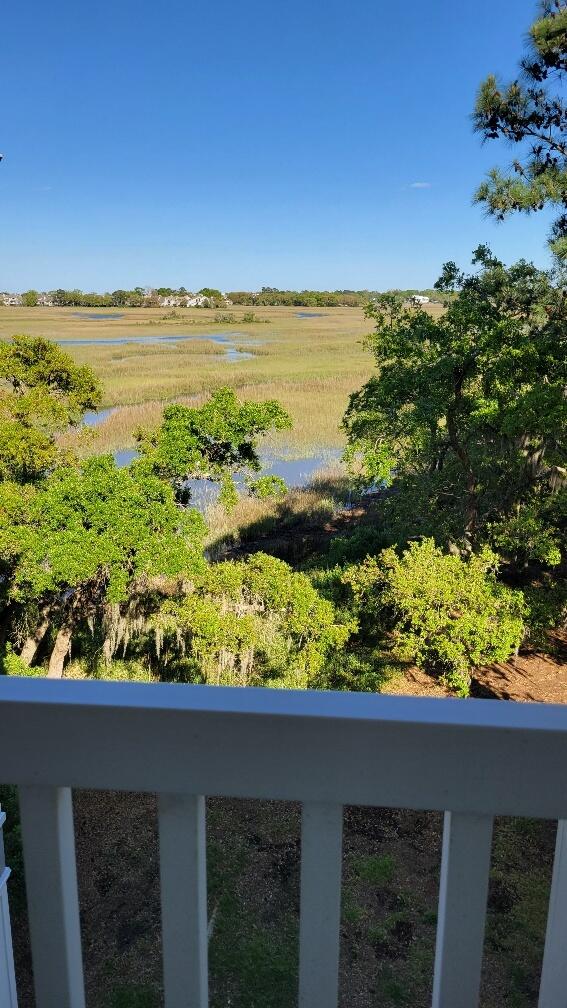 view of yard featuring a rural view and a water view