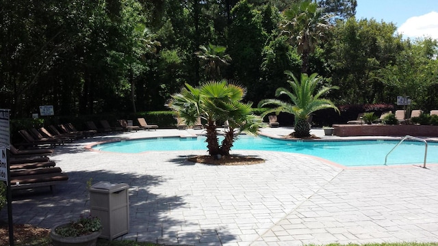 view of swimming pool featuring a patio area