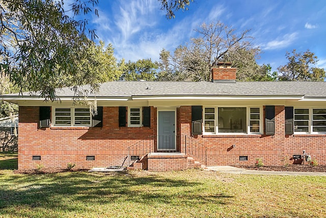 view of front facade with a front lawn and cooling unit