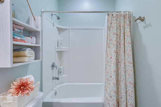 bathroom with shower / bath combo with shower curtain