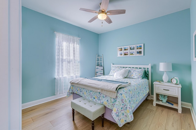 bedroom featuring ceiling fan and light hardwood / wood-style flooring