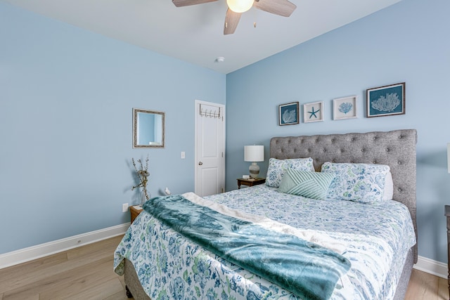 bedroom featuring light hardwood / wood-style floors and ceiling fan