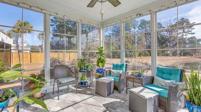 sunroom / solarium with ceiling fan