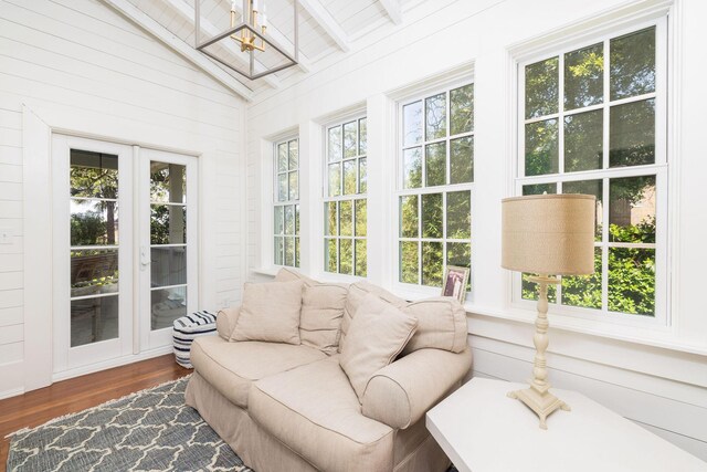 sunroom / solarium featuring vaulted ceiling and wooden ceiling