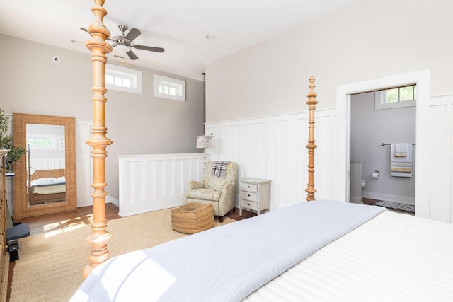 bedroom featuring wood-type flooring, ceiling fan, and multiple windows