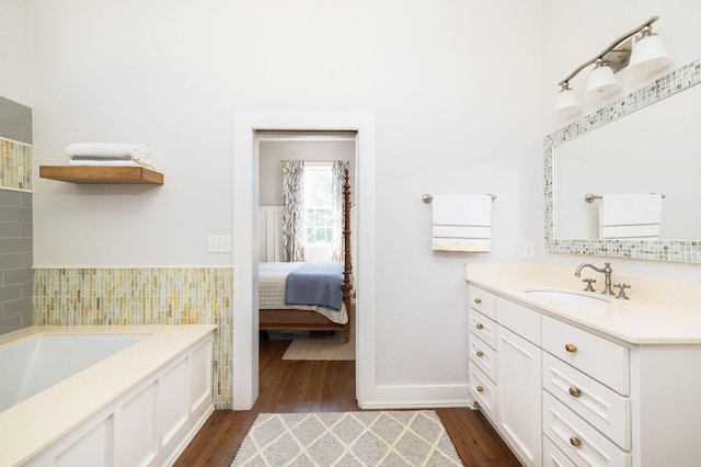 bathroom featuring hardwood / wood-style flooring and vanity