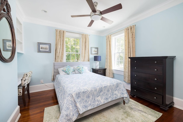 bedroom featuring ornamental molding, dark hardwood / wood-style floors, multiple windows, and ceiling fan