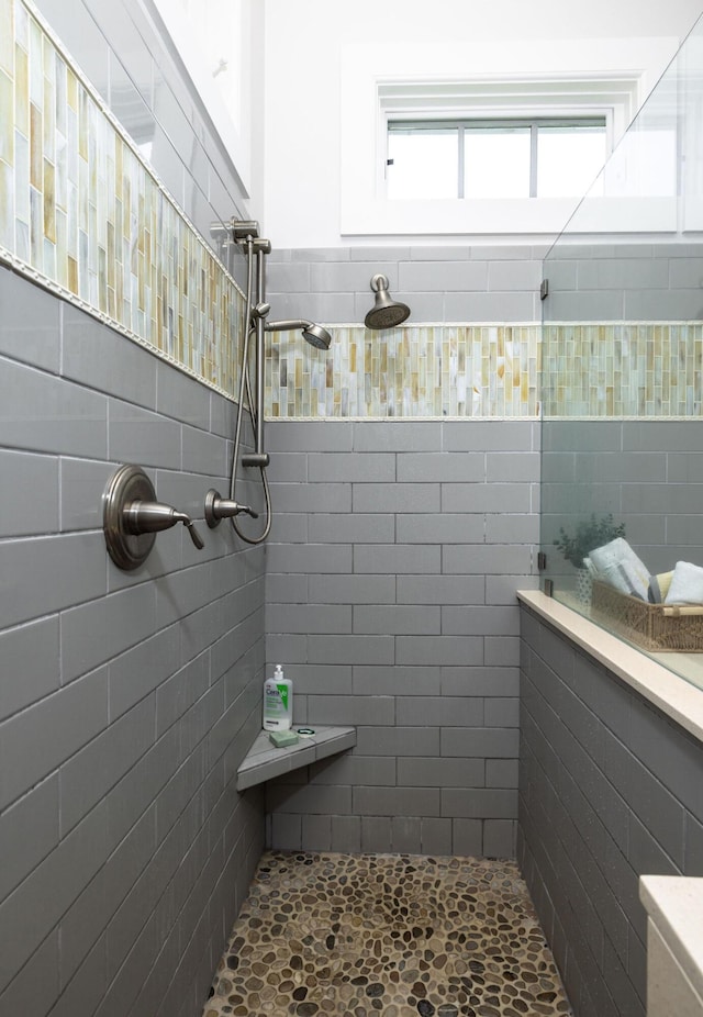 bathroom with tiled shower