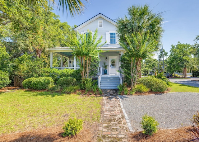 view of front of house featuring a front yard and covered porch