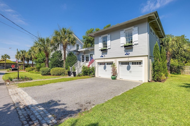 view of front of house featuring a garage and a front yard