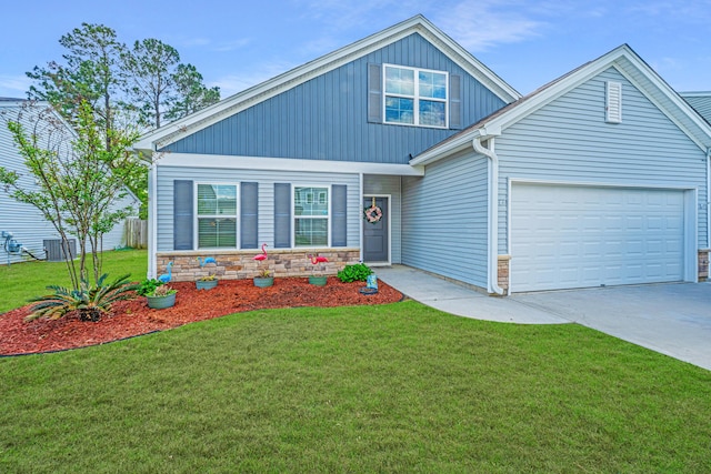 view of front of house featuring a garage, a front lawn, stone siding, central AC unit, and concrete driveway