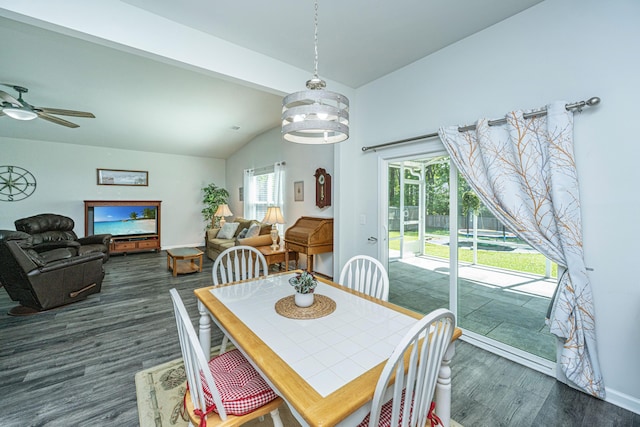 dining space with baseboards, ceiling fan, lofted ceiling with beams, and dark wood finished floors