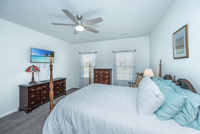 carpeted bedroom featuring visible vents, a ceiling fan, and baseboards