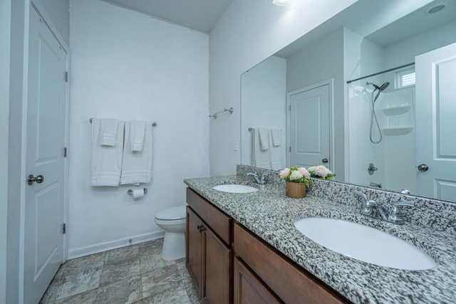 full bath featuring a sink, baseboards, walk in shower, and toilet