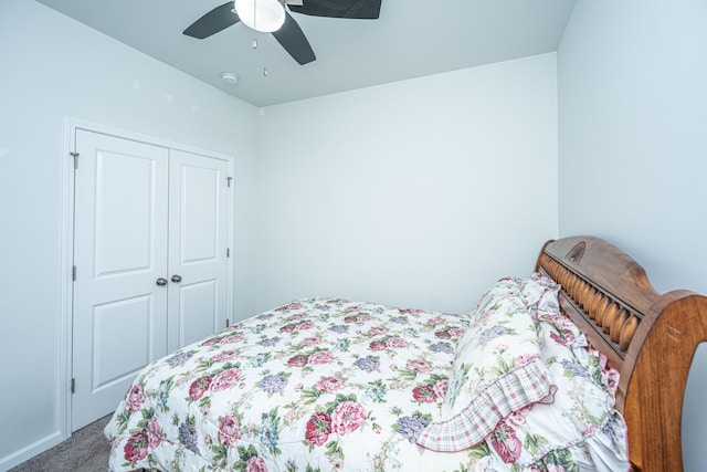bedroom with carpet floors, ceiling fan, and a closet
