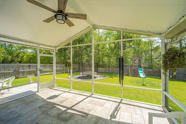 unfurnished sunroom with plenty of natural light and ceiling fan
