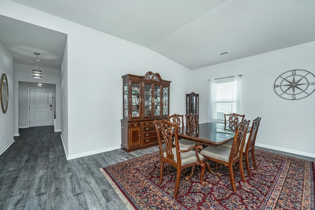 dining area with baseboards, vaulted ceiling, dark wood-style floors, and visible vents