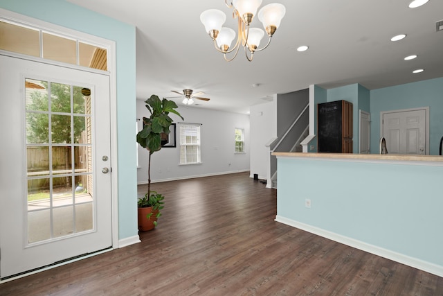 interior space featuring recessed lighting, baseboards, and dark wood-style floors