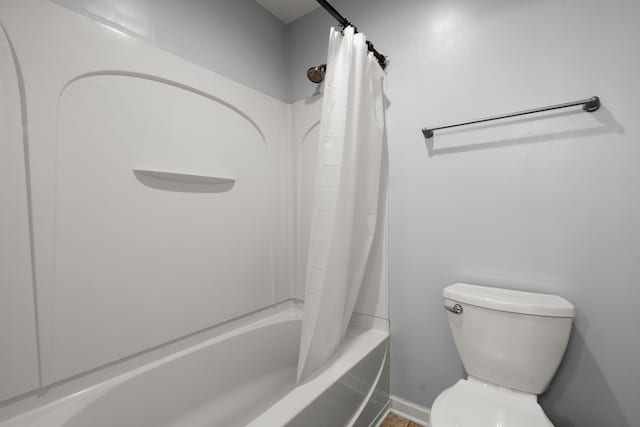 full bath featuring shower / bath combo and toilet