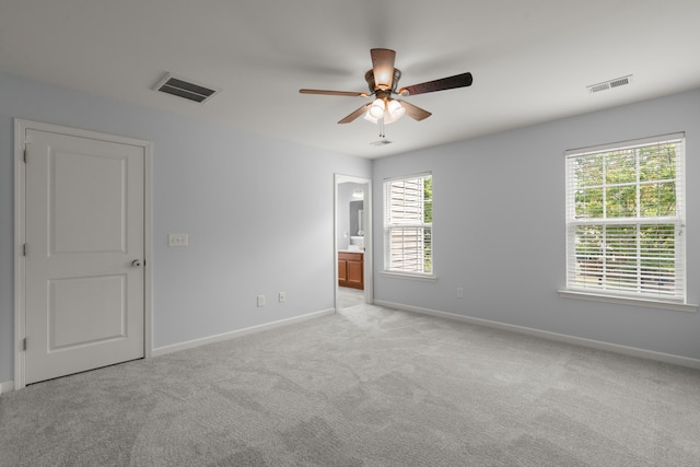 empty room with baseboards and visible vents