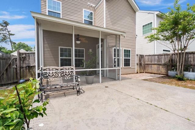 back of property featuring a fenced backyard, a patio, and ceiling fan