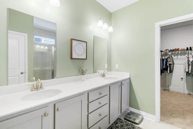 bathroom with vanity and a shower with shower door