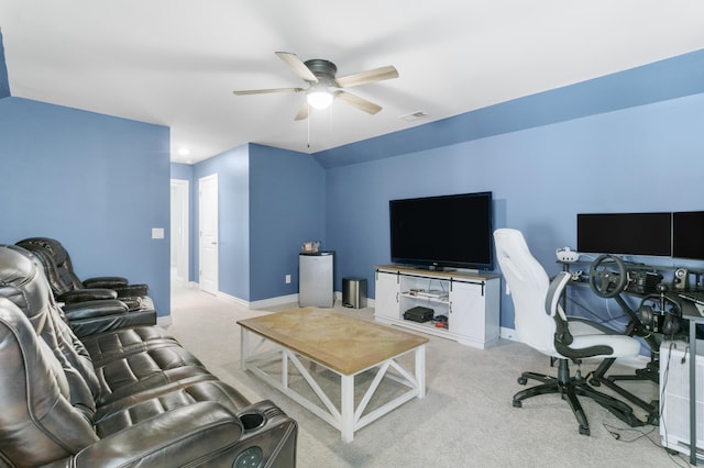 carpeted living room with ceiling fan