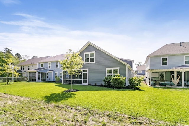 rear view of house with a lawn