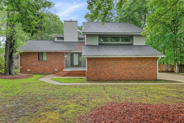 105 Londonderry Rd, Goose Creek, SC 29445 - view of front facade featuring a chimney, a shingled roof, and brick siding