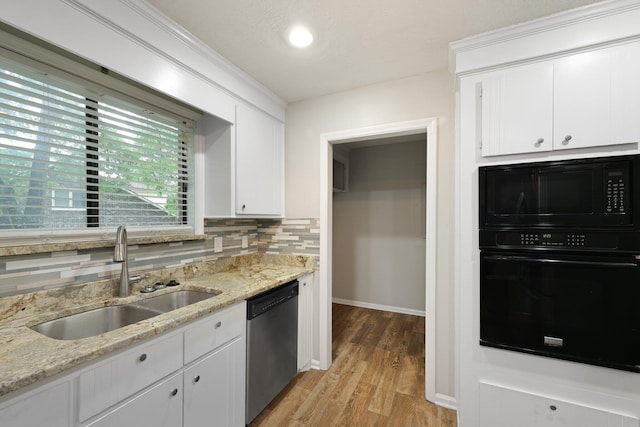 105 Londonderry Rd, Goose Creek, SC 29445 - kitchen featuring black appliances, a sink, light wood-style floors, backsplash, and white cabinetry