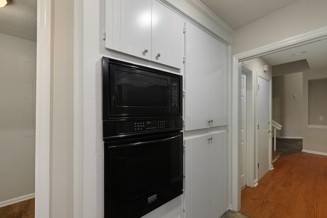 105 Londonderry Rd, Goose Creek, SC 29445 - kitchen featuring black appliances, white cabinets, light wood finished floors, and baseboards