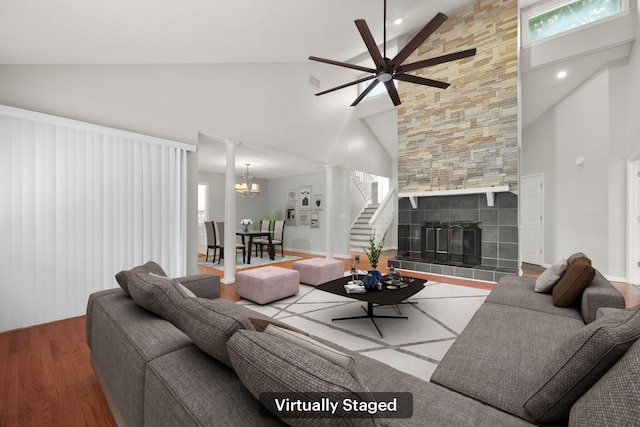 105 Londonderry Rd, Goose Creek, SC 29445 - living area featuring wood finished floors, high vaulted ceiling, a ceiling fan, stairway, and a tile fireplace