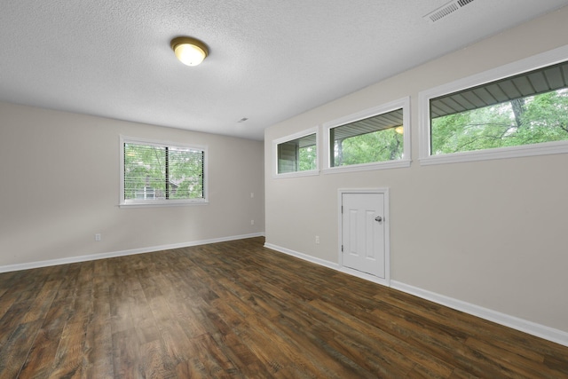 105 Londonderry Rd, Goose Creek, SC 29445 - empty room featuring dark wood finished floors, baseboards, and a textured ceiling