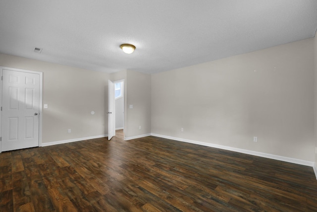 105 Londonderry Rd, Goose Creek, SC 29445 - unfurnished room featuring dark wood-style flooring, baseboards, and a textured ceiling
