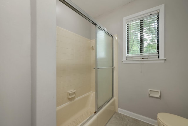 105 Londonderry Rd, Goose Creek, SC 29445 - full bathroom featuring tile patterned floors, bath / shower combo with glass door, toilet, and baseboards