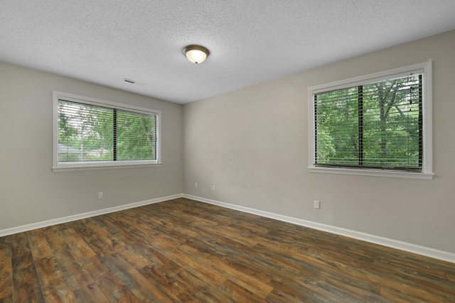 105 Londonderry Rd, Goose Creek, SC 29445 - spare room with dark wood-type flooring, baseboards, and a textured ceiling