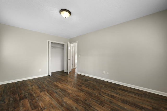 105 Londonderry Rd, Goose Creek, SC 29445 - unfurnished bedroom featuring baseboards, dark wood-style flooring, and a closet