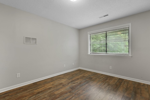 105 Londonderry Rd, Goose Creek, SC 29445 - spare room featuring dark wood-style flooring, baseboards, and a textured ceiling