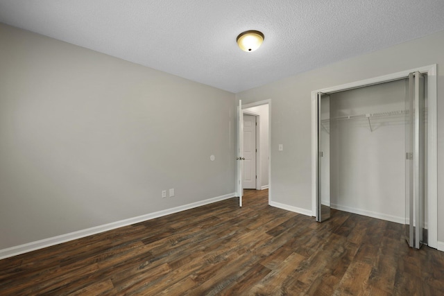 105 Londonderry Rd, Goose Creek, SC 29445 - unfurnished bedroom with dark wood-style floors, a closet, baseboards, and a textured ceiling