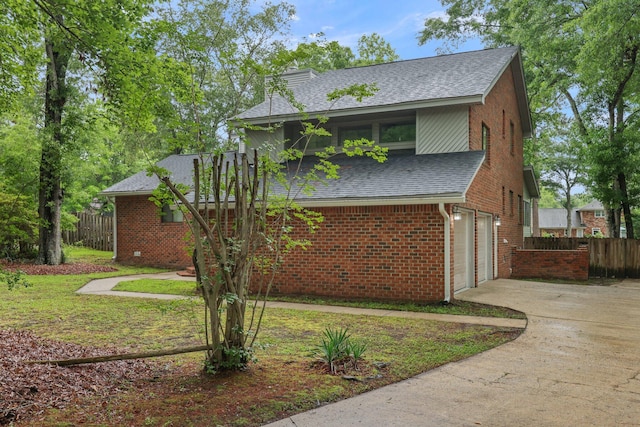 105 Londonderry Rd, Goose Creek, SC 29445 - view of home's exterior featuring roof with shingles, fence, a garage, and concrete driveway