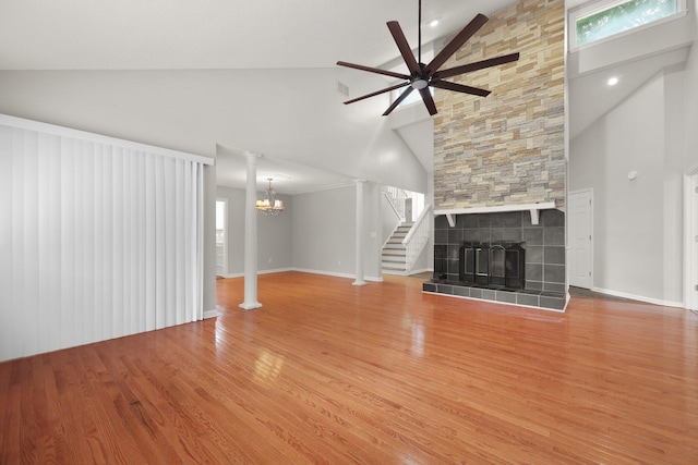 105 Londonderry Rd, Goose Creek, SC 29445 - unfurnished living room featuring high vaulted ceiling, ceiling fan, wood finished floors, a tile fireplace, and a chandelier
