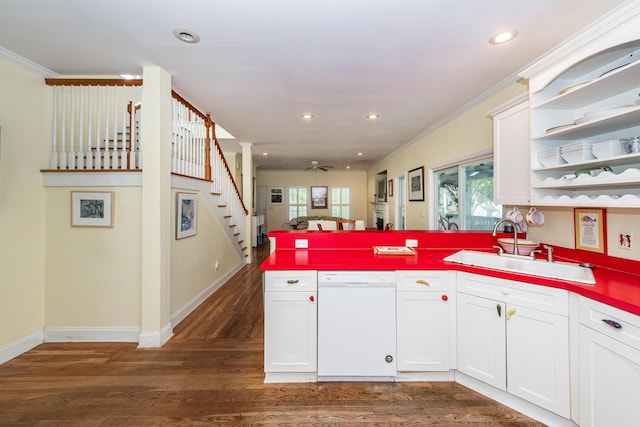2613 Rivertowne Pkwy, Mount Pleasant, SC 29466 - kitchen with white dishwasher, a sink, a peninsula, dark wood-style floors, and ornamental molding