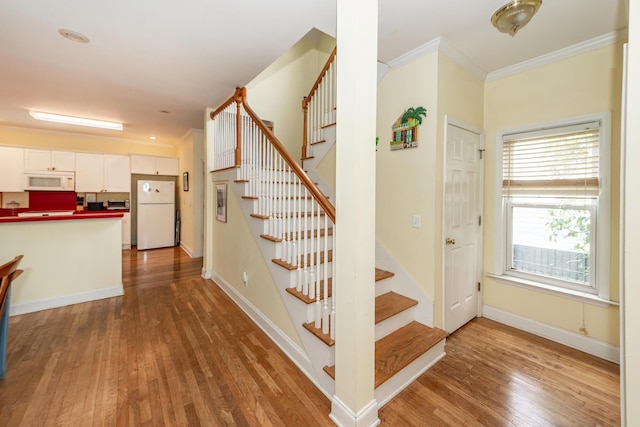 2613 Rivertowne Pkwy, Mount Pleasant, SC 29466 - staircase with wood finished floors, ornamental molding, and baseboards