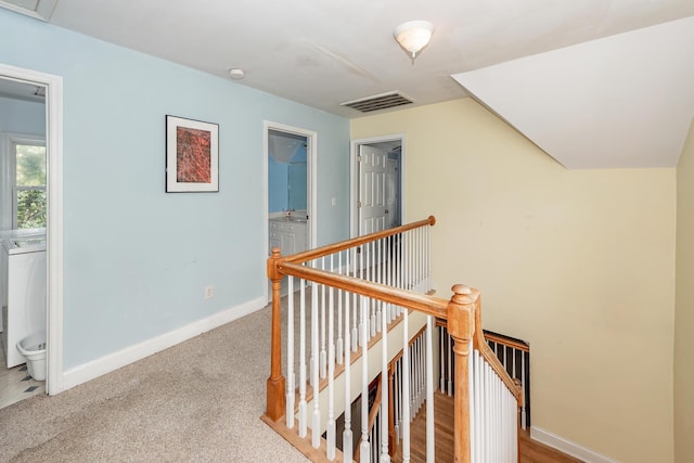2613 Rivertowne Pkwy, Mount Pleasant, SC 29466 - hall with an upstairs landing, baseboards, carpet flooring, and washer / dryer