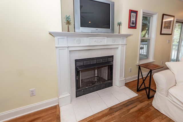 2613 Rivertowne Pkwy, Mount Pleasant, SC 29466 - detailed view of wood finished floors, a tiled fireplace, and baseboards