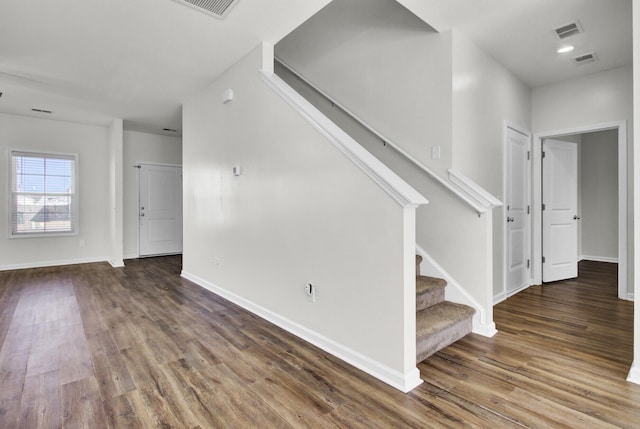 stairway featuring wood-type flooring