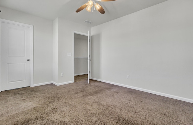 unfurnished bedroom featuring ceiling fan, a closet, and carpet flooring